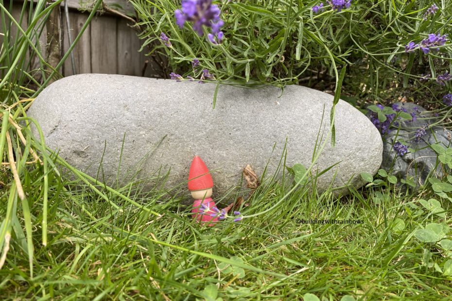 red tomten next to a rock