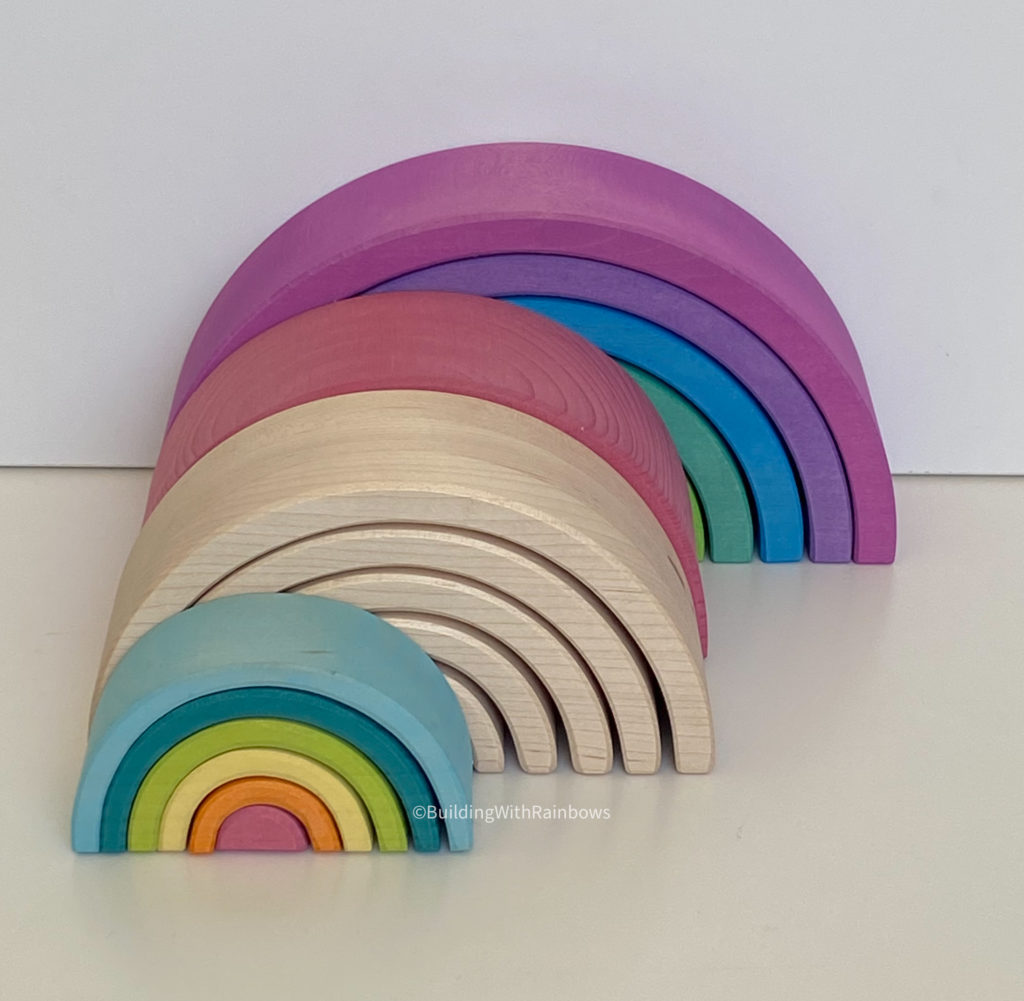 6-piece rainbow stackers:  Grimm's mini rainbow, Myer's Natural 6-piece rainbow, Grimm's medium rainbow, ocamora 6-piece rainbow