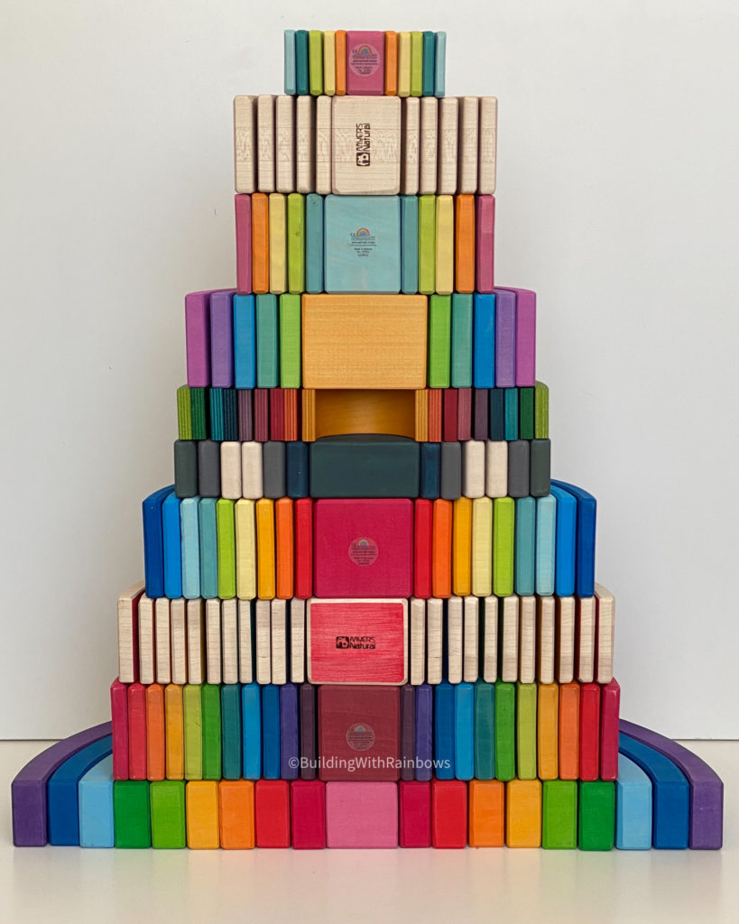 Stack of Rainbow stackers: Bauspiel, Grimms, Myer's Natural, Sabo Concept, Naef, Ocamora